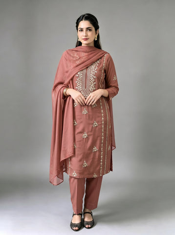 A beautifully crafted three-piece  suit, handmade with intricate gota work for an elegant, traditional finish....