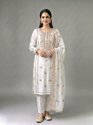 A beautifully crafted three-piece  suit, handmade with intricate gota work for an elegant, traditional finish....